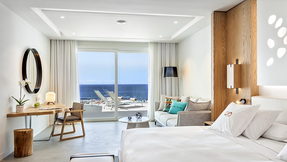 All white: A suite at the Royal Hideaway Corales Beach. Sudi said the breakfast at the hotel included 'heaped platters of local cheeses, a Canarian take on sobrasada, every subtropical fruit imaginable, and a bread range to make a Bake Off winner swoon, plus a carving of Iberico bellota (acorn-fed ham)'