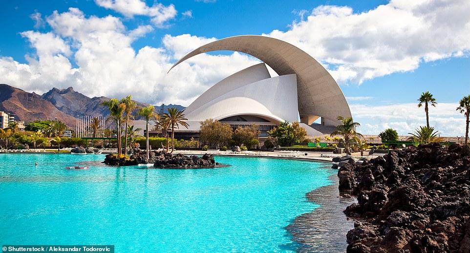 Curve appeal: The Auditorio de Tenerife concert hall in Santa Cruz, which 'hogs the architectural limelight with its 190ft-high curved eclipse-like roof'