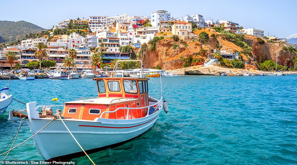 Agia Galini, pictured, is the backdrop to Alan's new novel, One Of Our Ministers Is Missing. He says the restaurants there are 'excellent' and there is a 'quiet beach' to enjoy